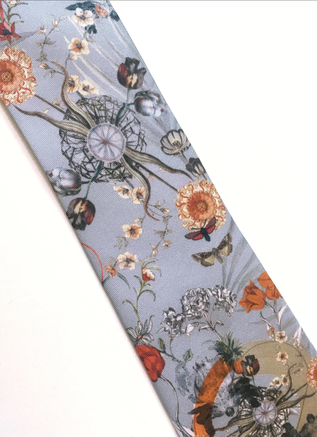 Hand painted, 100% silk pale blue tie with floral print