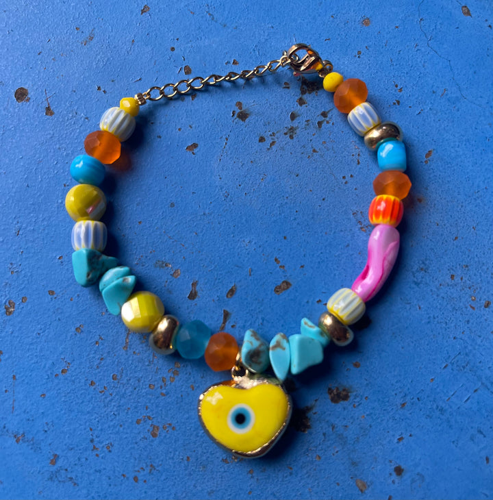 Yellow evil eye with rainbow glass and ceramic beads bracelet