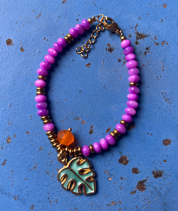 Purple shell beads with tropical leaf charm bracelet