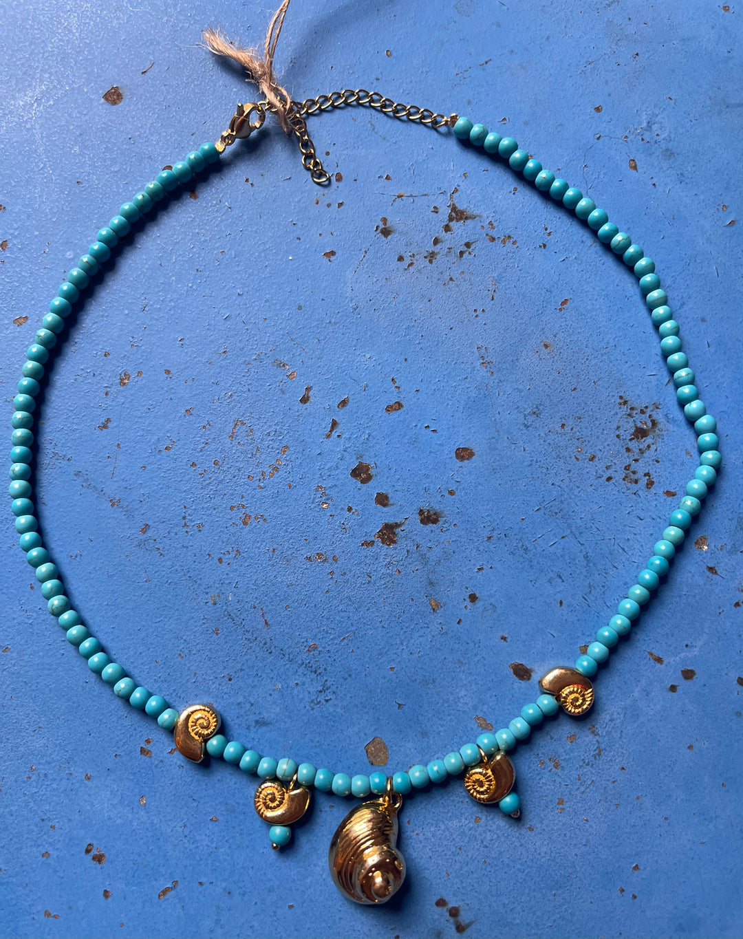 Nautilus Gold Shell necklace with turquoise beads