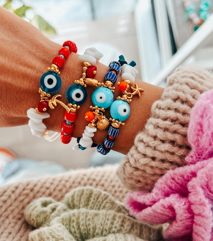 Red semi precious beads with blue evil eye protection bracelet