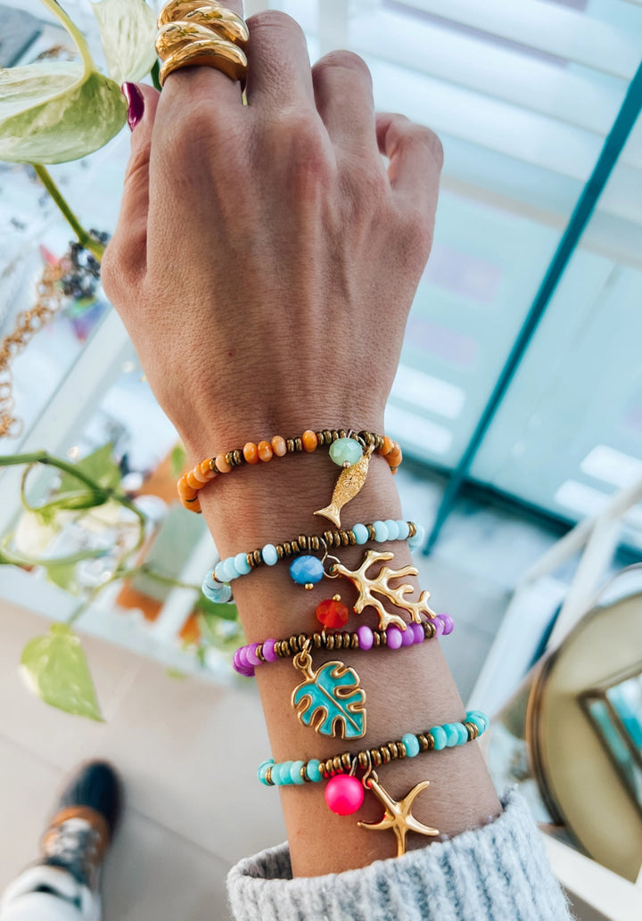 Exotic charm bracelet/turquoise with gold plated coral charm