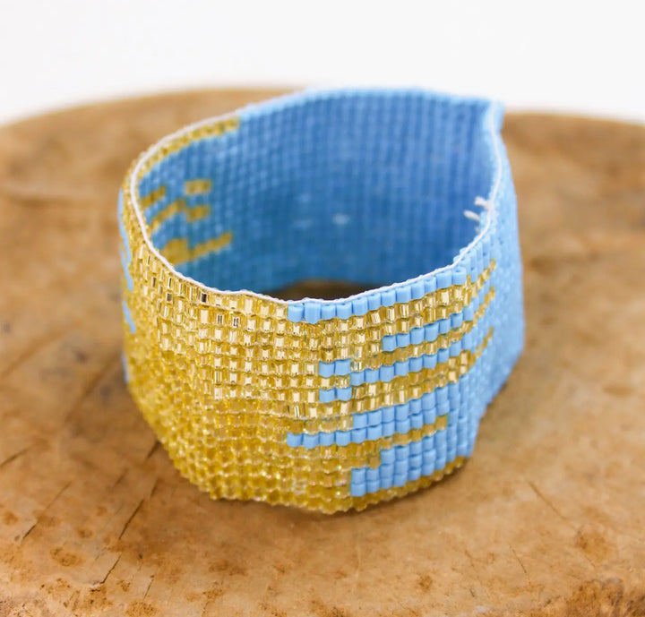 Hand beaded blue and gold metallic stretch bracelet