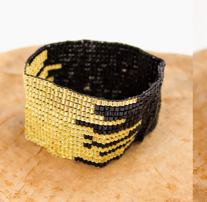 Hand beaded black and gold metallic stretch bracelet